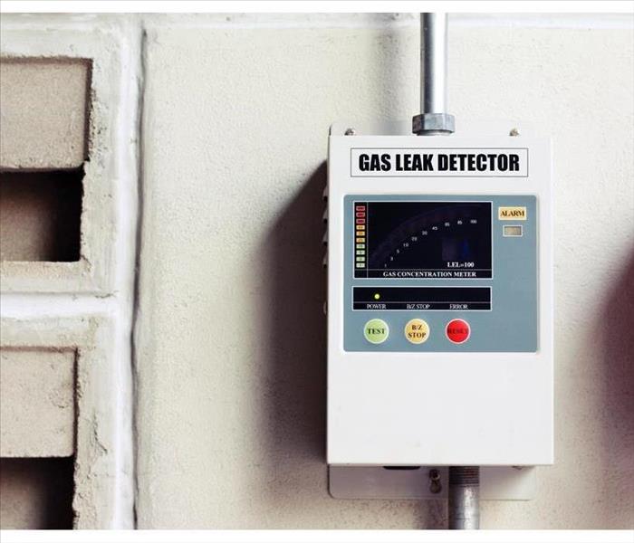 gas leak detector box on cement wall