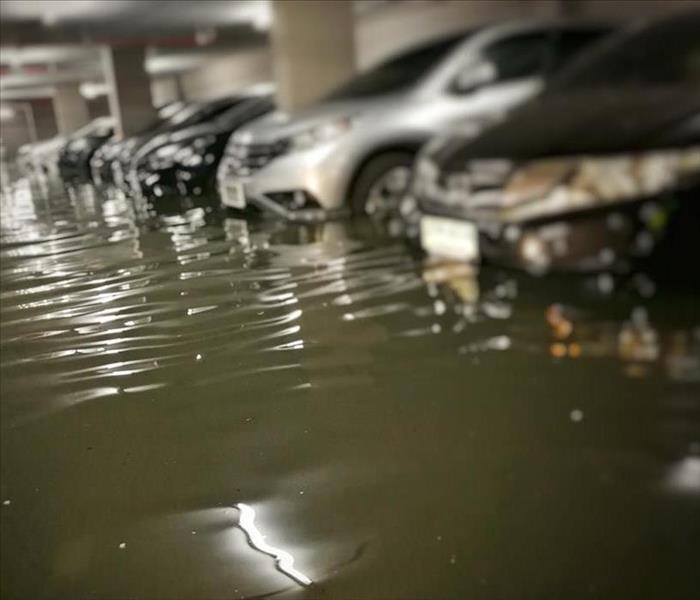 Commercial garage flooded, cars parked